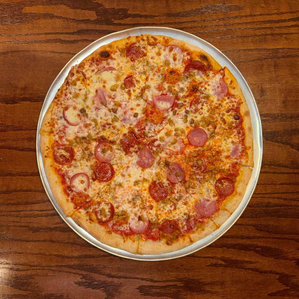 Indulge in Our Meat Lovers Pizza